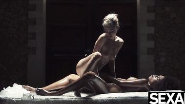 Black beauty and hot blonde oil each other up for lesbian sex