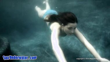 Brunette with natural tits having fun under the water