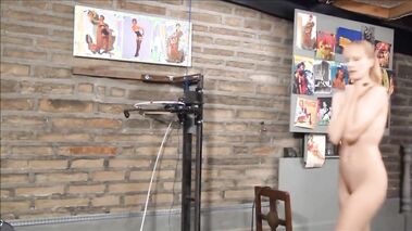 Blonde having fun with a spanking machine