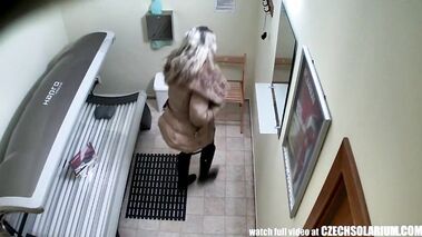 Blonde girl tanning naked