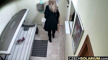 Blonde masturbates and fingers her pussy while tanning