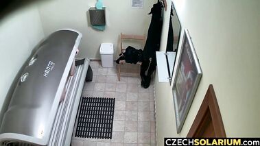 Blonde masturbates and fingers her pussy while tanning