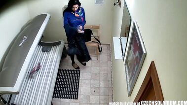 Awesome brunette with perfectly shaven pussy in tanning salon