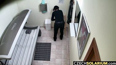 Short haired girl masturbates in tanning salon